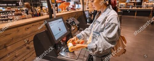 stock-photo--july-cologne-germany-girl-customer-scanns-and-pays-for-bottle-of-juce-at-an-automated-2238546577